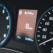 Detailed view of a car dashboard featuring speedometer and digital display showing 0 km/h.